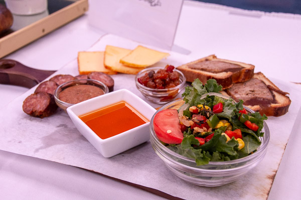 The duo’s platter and charcuterie board feature a Cajun corn and kale salad, haymarket pate en croute with a spicy peach chutney, andouille sausage with homemade spicy mustard, and an assortment of smoked Gouda cheese with Cajun seasoning.