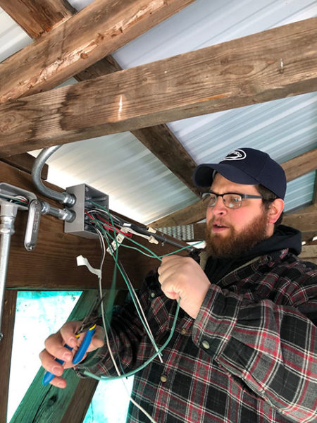 Ian J. Chilcote, of Altoona, was one of 15 electrical technology students from tasked with installing electrical power.