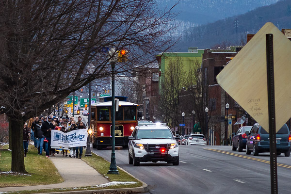Supported by the Williamsport Bureau of Police and a River Valley Transit trolley, the group travels north on Market Street.