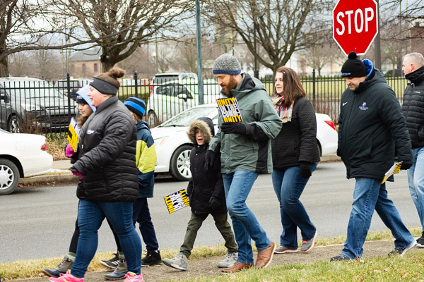 Banded and bundled, the multigenerational throng goes through its paces.