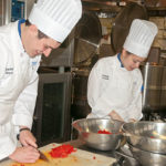 Wisneski (with Zachary Derck, another culinary grad) in a 2012 file photo