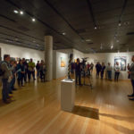 The exhibition’s curator addresses the crowd that spanned the length of the gallery.