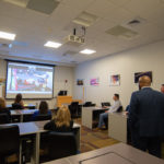 The tour group stops by the videoconferencing facilities in the Workforce Development Center ...