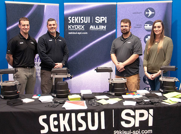 Representatives of SEKISUI SPI hosted a thermoforming station for area elementary and middle school children during an annual Science Festival at Pennsylvania College of Technology, which was sponsored by Penn College, Lycoming College and the Williamsport/Lycoming Chamber of Commerce. From left are Lucas Allen, a 2001 Penn College graduate, William Kitchen, Joshua Andress and Kahla Manning.