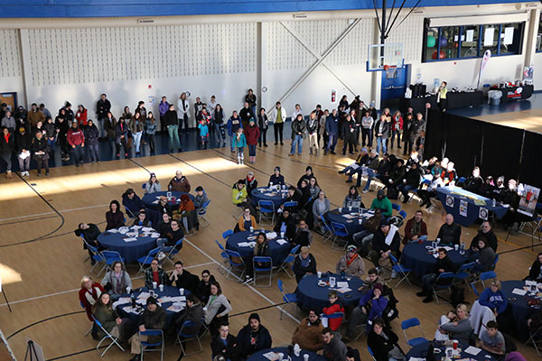 Volunteers crowd the Lycoming College Recreation Center, learning how their helping hands will ease hunger in the region.