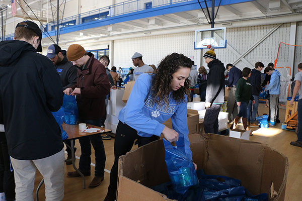... who assembled hundreds of meal kits for distribution to needy local families.