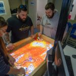 Students assess the virtual, visual representation of altered terrain. From left are Ashly M. Gagliardi, of Belle Vernon; Scott R. Seneca, of Lewisburg; and Matthew J. Eck, of Carlisle, all majoring in civil engineering technology.