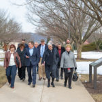 President Davie Jane Gilmour (center) leads a brisk walk across campus, as "Spring Break" begins in name only.