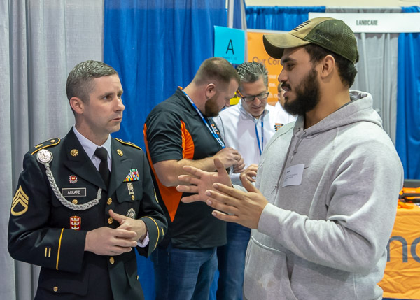 Joshua Castro Ayala, of Carlisle, enrolled in heavy construction equipment technology: technician emphasis, visits the Pennsylvania Army National Guard booth.