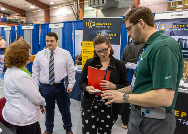 B. Braun Medical Inc.'s Carolyn Johnson (left) and alumnus Daniel M. Dietrich ('08 and '09) team up for meet-ups with plastics and polymer engineering technology majors Joshua A. Berger, Hughesville, and Shawnee M. Mills, Waldorf, Md.