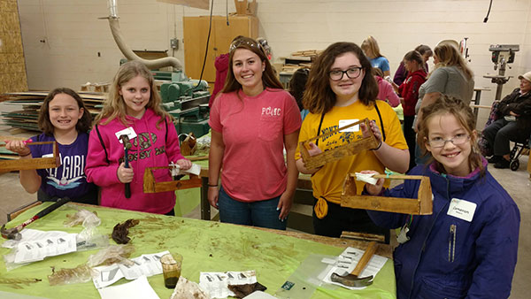 Kristina M. Holland (center), of Mechanicsburg, majoring in building science and sustainable design: architectural technology concentration, mentors a colorfully clad group.