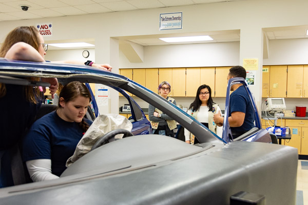 Paramedic and physician assistant students help Scouts toward their Senior First Aid badges, demonstrating emergency head care for people injured in motor vehicle accidents.