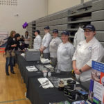 Penn College students prepare to interact with guests.