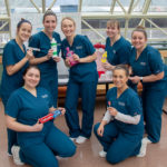 Dental hygiene students provide fun learning stations for families visiting the event. Standing, from left, are Lori M. Weaver, of Newmanstown; Hailey A. Gearhart, of Philipsburg; Dana L. Kraft, of Royersford; Samantha K. Steiger, of Howard; and Michayla J. Roberts, of Newville. Kneeling are Sydney E. Brewer, of Gettysburg, and Staci M. Senior, of State College.