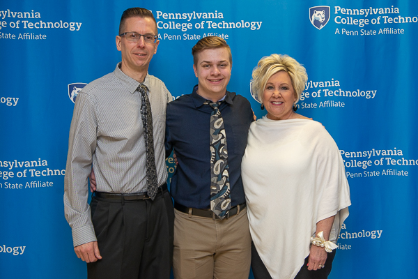 Recipient of the Liberty Excavators Endowed Scholarship, Trevor C. Kulynycn, civil engineering technology, enjoys the day with his parents.