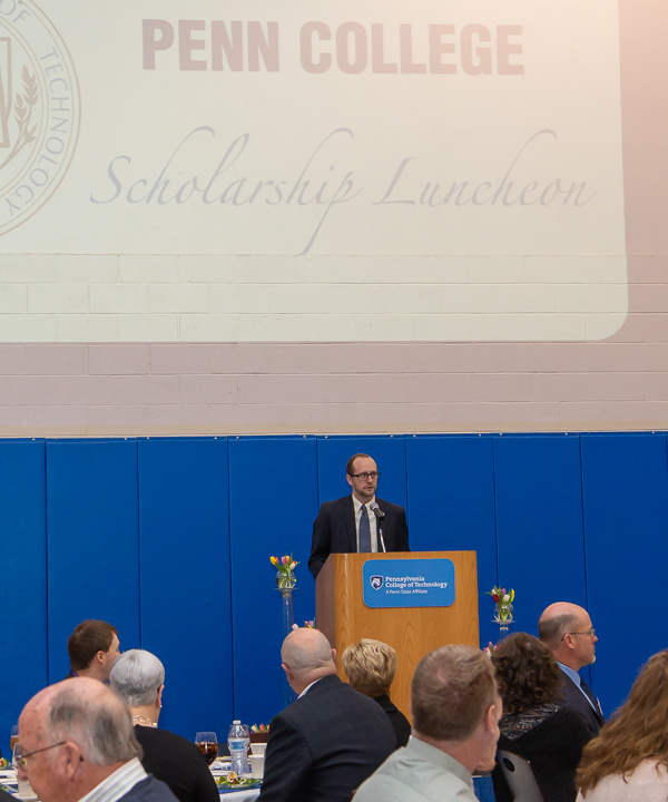 Kyle A. Smith, executive director of the Penn College Foundation, welcomes the crowd of approximately 300 guests to the second annual Scholarship Luncheon. 