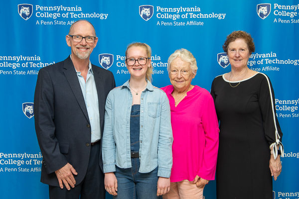 The Phillips Family Scholarship recipient Kendra M. Snyder (center), landscape/horticulture technology: landscape emphasis, savors the day with members of the Phillips family (from left): Trey, Annmarie and Judy. 