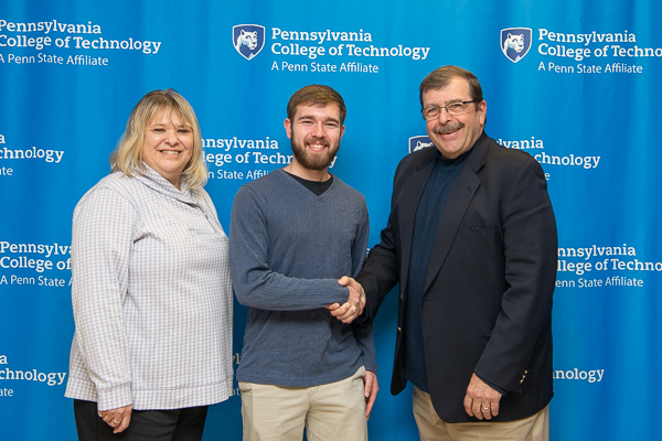 A handshake and appreciation are delivered by building construction technology student Matthew D. Yoder (center) to his scholarship’s donors, Tacie and Paul H. Rooney Jr. The Rooneys established the C. Leroy and Evelyn M. Kimble Scholarship in memory of Tacie’s parents. Yoder is also the recipient of Wolyniec Construction Scholarship. 