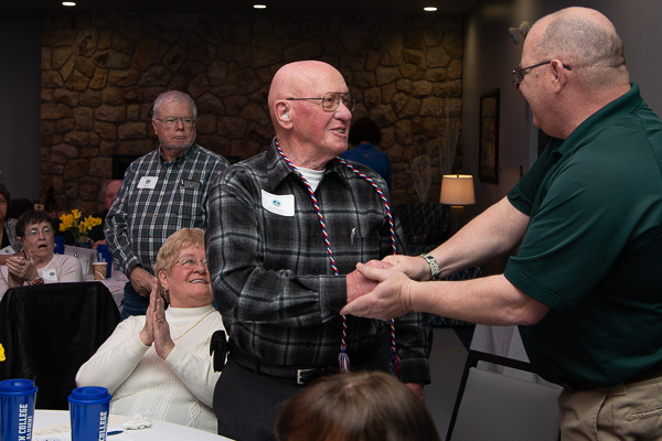 Beaver, a 25-year Army veteran, presides over the presentation of honor cords. Included in the tribute was Paul Schriner, ’63, welding, and a longtime faculty member. Wife Shirley (to Schriner's right) joins in the applause; she also was a college employee, retiring in 1999 as secretary of academic support services.