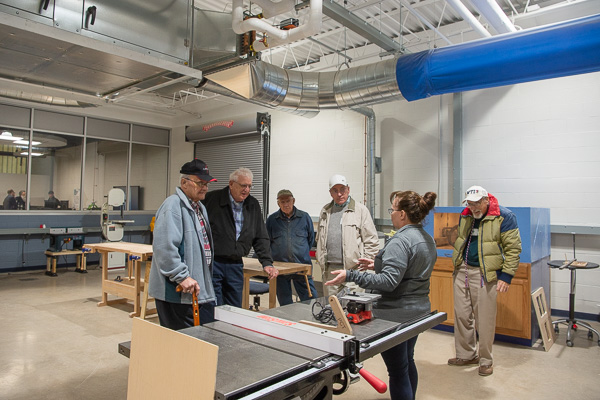 Roberta Schwenk, makerspace assistant, leads a tour into The Logue Fabritorium side of the workshop.
