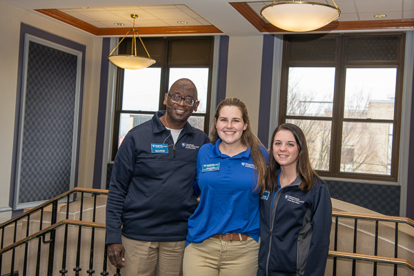 Greeting guests outside the ACC Auditorium are (from left): Lee A. Dawson, admissions counselor, and Student Ambassadors Kacie C. Snyder and Elizabeth Wellar. 