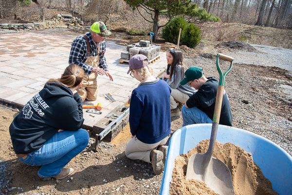 Never shying from a worthwhile project, landscape/horticulture technology students – with Michael A. Dincher, assistant professor – construct a patio behind the Schneebeli Earth Science Center.