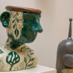 A carved “green man” by Sydney O. Powell, of Linden, graphic design