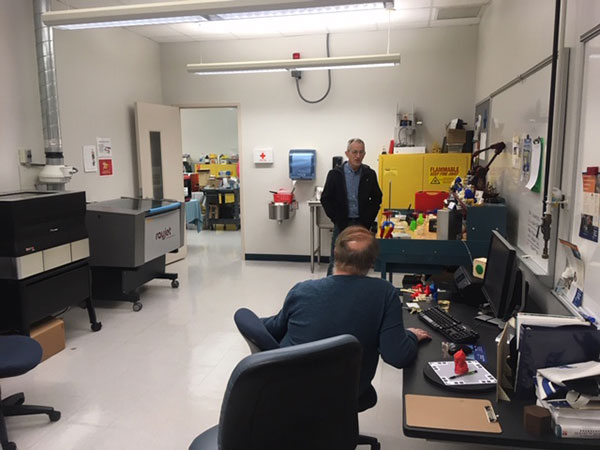 ... and Eric K. Albert (seated), associate professor of machine tool technology/automated manufacturing.