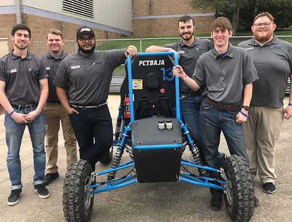 Members of the design crew for Penn College’s Baja SAE team pose beside their handiwork during a break at a recent competition in Tennessee. From left are Jacob C. Hudock, of Berwick; Bradley M. Haines, of Mifflinburg; Shujaa AlQahtani, of Saudi Arabia; Trevor M. Clouser, of Millmont; Mark A. Turek, of Red Lion; and Matthew J. Nyman, of Lock Haven.