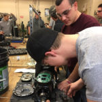 The students tear down a semi-hermetic compressor during the hands-on portion of the class. 