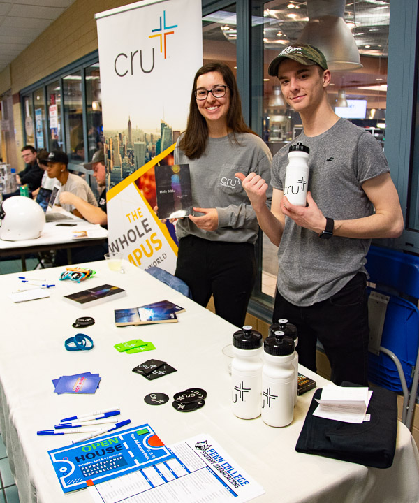 Among those staffing a table at the Campus Life Involvement Fair are Cru's Autumn G. McCrum and Graham E. Burnett.