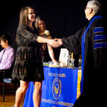 Crossing the stage in celebration ...