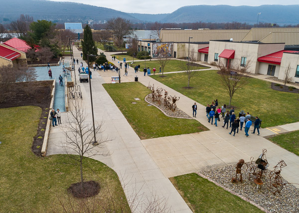 A campus tour passes the Lycoming Engines Metal Trades Center, where the nearby procession of welded sculptures was created.