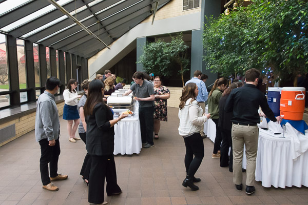 Attendees sample the tasty offerings.
