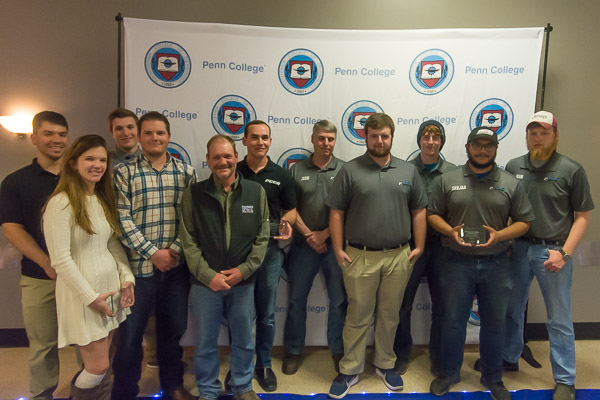 Students and advisers of 2018-19's outstanding organizations, Baja SAE and the Penn College Construction Association, stand for a joint memento.