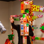 Immersed in his work, Ferraro engages the gallery crowd.