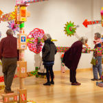 Echoing the multi-directional exhibit, patrons take divergent paths to appreciation.