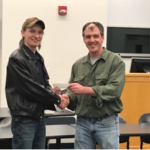 Johnson (left) accepts his award from Ziegler.
