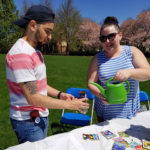 CPE David A. Gadalla, an aviation maintenance technology major from Mechanicsburg, and Sammie L. Davis, coordinator of diversity and cultural life, plant the seeds for a greener planet,