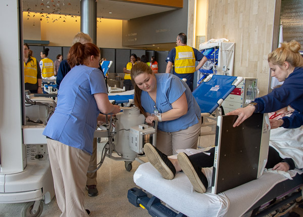 Radiography student Emily Kepner (center), of Muncy, positions the X-ray tube on a mobile unit to capture an image of an injured ankle with the assistance of classmates Hetzel and  Caitlin A. Dauberman (far right, holding the image receptor), of Muncy.