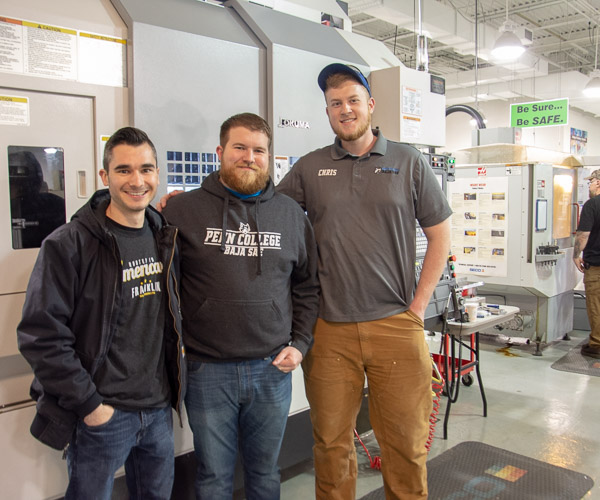 Alumni and former Baja team members Johnathan T. Capps, ’18, applied technology studies, and ’16, mechatronics engineering technology, and Logan B. Goodhart, '18, manufacturing engineering technology, join current Baja team member Christopher M. Schweikert, a manufacturing engineering technology student from Jamison, in the automated manufacturing lab.