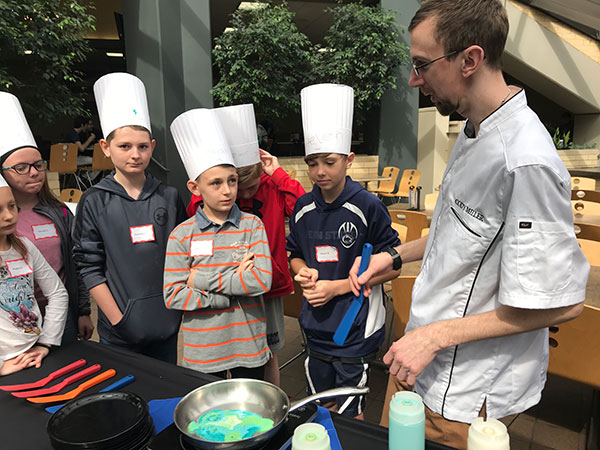 Cody J. Miller, head cook at Capitol Eatery, leads a hands-on Pancake Art exercise.