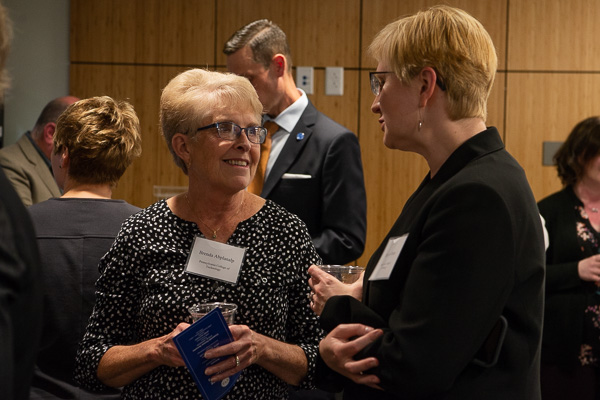 Shannon Munro (right), vice president for workforce development, talks with Brenda G. Abplanalp, former director of Penn College at Wellsboro, who was thanked for her steadfast leadership and continuing support of workforce training.