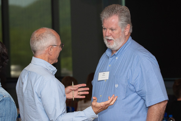 Jim Kuhn (right), manager of training and development with South Carolina company J.W. Aluminum, converses with Russ Lawrence, director of innovation, IMC.