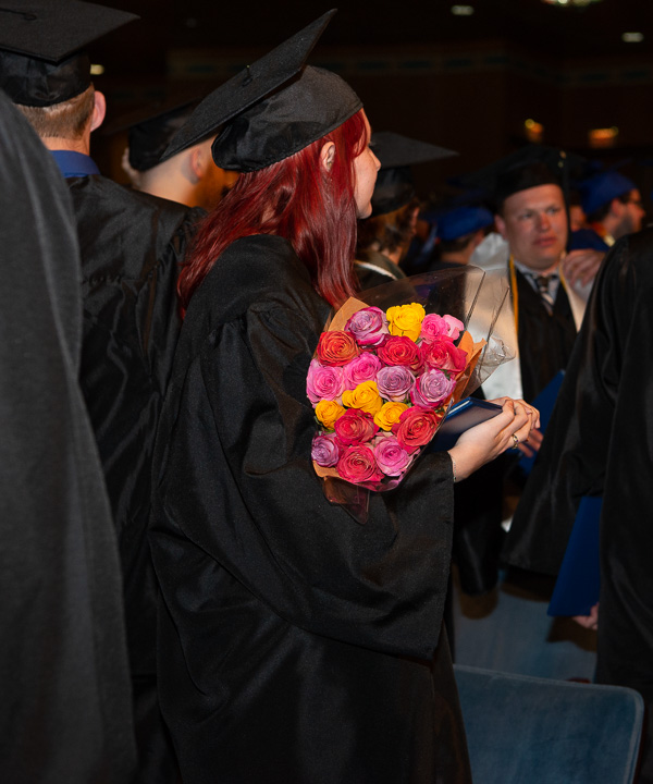 Engineering CAD technology graduate Catherine E. Weatherman awaits the recessional with roses in hand. 