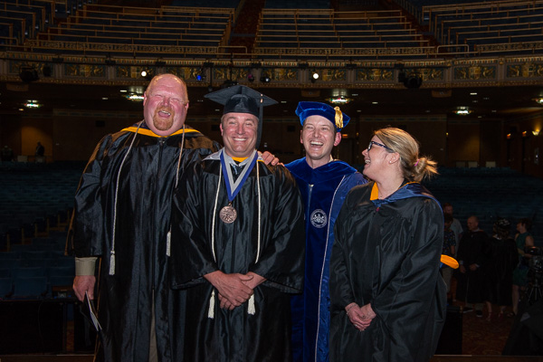 Good and funny! The newly-minted Master Teacher (second from left) enjoys a laugh with his school’s administrators (from left) Dave R. Cotner, dean, and Bradley M. Webb and Stacey C. Hampton, assistant deans of industrial, computing and engineering technologies. 