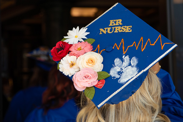 Vanessa N. Klees, nursing, incorporated her dog's pawprint into her cap design.