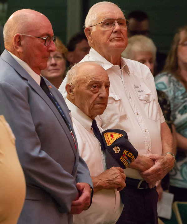 Fred Agnoni, of South Williamsport, a teenage Army officer in the Korean War, holds his hat to his heart during the Reading of the Orders by retired Army Maj. Gen. James Joseph. Agnoni is standing between fellow veterans Richard E. Barkman (left), of Jersey Shore, and Edward E. Adams, of Muncy.