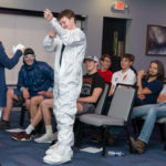Dylan Berguson likewise complies with the West dress code – complete with “moon boots” – to the delight of classmates. 
