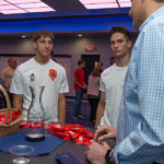 Kit Kats and conversation! The Hershey Co.’s Chad Brownell (right), technical assurance manager, discusses opportunities at the company’s Hazleton plant.